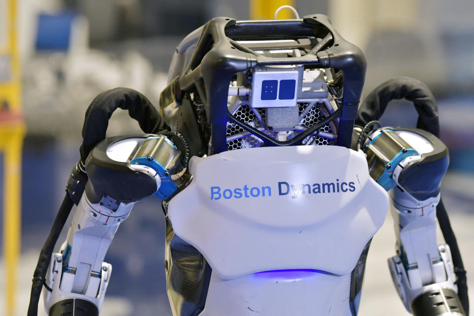 A Boston Dynamics Atlas robot performs a movement during a demonstration, Wednesday, Jan. 13, 2021, at the company's facilities in Waltham, Mass. The company engineered the robot to be able to dance in a fluid manner that is almost human. (AP Photo/Josh Reynolds)