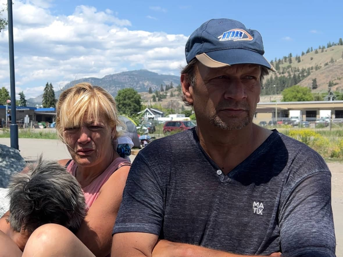 Garth Gorrel, right, and his wife, Debbie Houghtaling, have been camping along the Okanagan Rail Trail in the north end of downtown Kelowna, B.C., for two years, after relocating to the city to find work and affordable housing, with no success. (Brady Strachan/CBC - image credit)