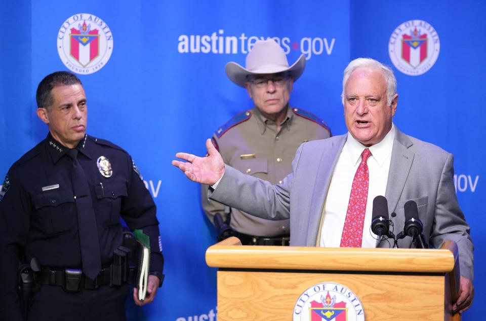 Austin police Chief Joe Chacon, left, and Texas Department of Public Safety Director Steve McCraw listen to Mayor Kirk Watson speak at a March 27 news conference about the new partnership between the city and state to police Austin.
