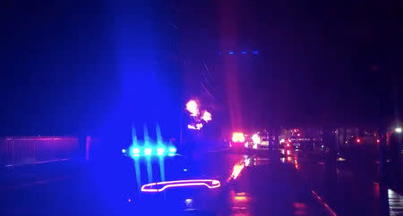 Lights flash from an emergency vehicle as a fire breaks out at an electrical substation in Fort Lauderdale, Florida, U.S., March 26, 2019 in this still image taken from a video from social media. JESSE SCOTT via REUTERS