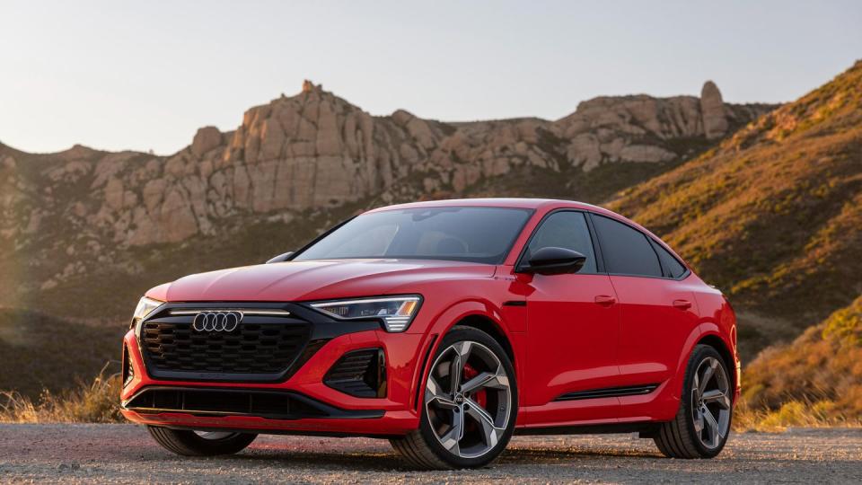 2024 audi sq8 etron sportback red car parked on a road