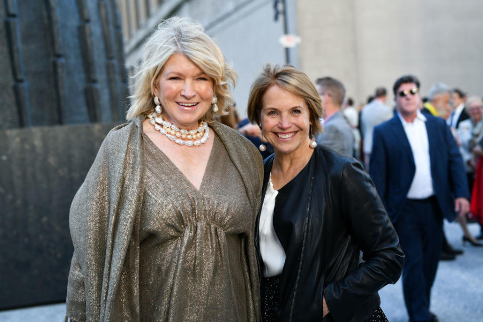 Martha Stewart standing next to Katie Couric at a benefit