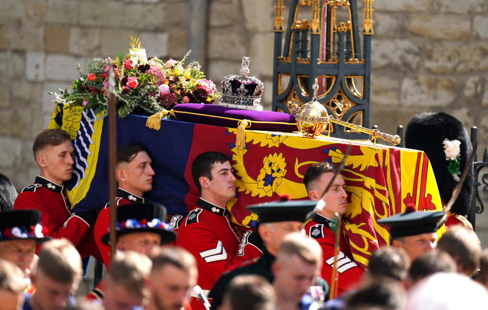 The coffin of Queen Elizabeth II, draped in the Royal Standard with the Imperial State Crown and the Sovereign's orb and sceptre, leaves Westminster Abbey during the State Funeral in London. Picture date: Monday September 19, 2022.