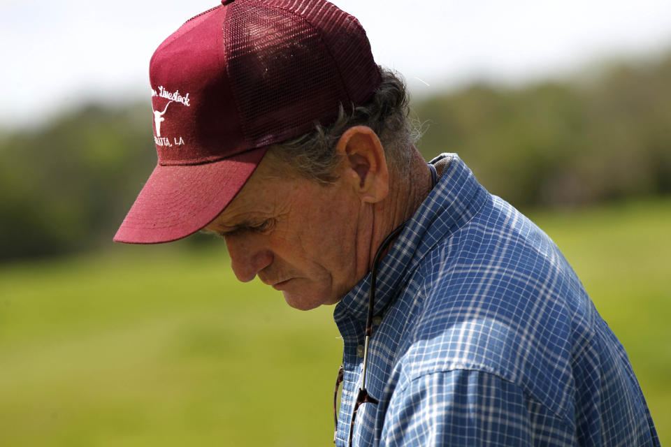 Keith Gantt pauses while feeding abandoned donkeys he have recovered, in Athens, La., Friday, March 16, 2012. Prolonged drought in the southern plains coupled with the nation’s economic slump has taken a heavy toll on the humble donkey. Across east Texas and north Louisiana, farmers whose grazing land has dried up have sold off herds of cattle, putting livestock-tending donkeys out of work and making it too expensive to keep those bought as pets or for other reasons. In the north Louisiana town of Athens, Keith Gantt, who rounds up loose livestock for the Claiborne Parish Sheriff's Office, has hundreds of donkeys he can't give away. He’s had some for two years. (AP Photo/Gerald Herbert)