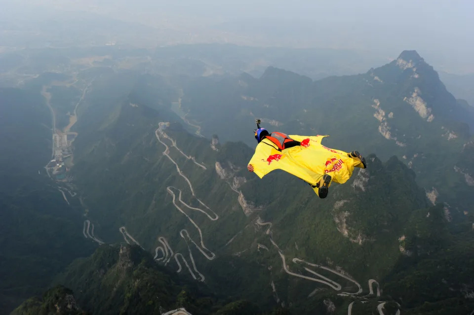 A thrill-seeker using a wingsuit.