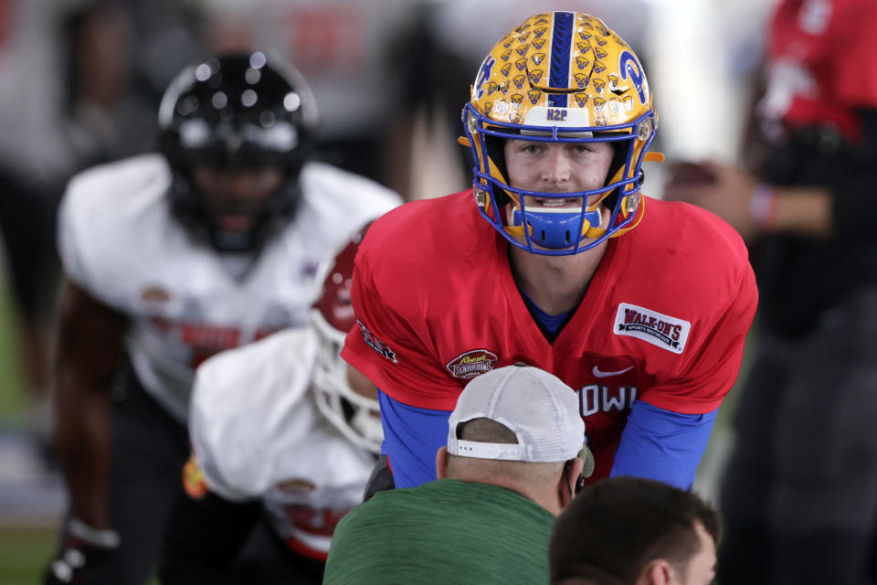 FILE - National Team quarterback Kenny Pickett of Pittsburgh (8) runs through drills during practice for the Senior Bowl NCAA college football game Thursday, Feb. 3, 2022, in Mobile, Ala. Pickett is expected to be taken in the NFL Draft. (AP Photo/Butch Dill, File)