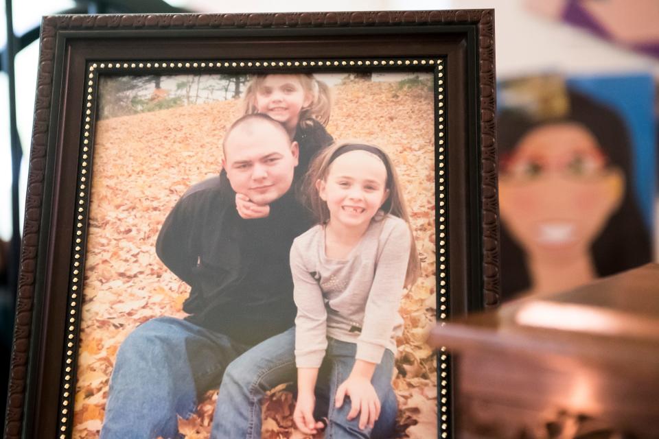 In this photo from Sept. 26, 2018, Zackery Rodkey, 29, of Hanover, is seen in this framed picture with his daughter, Zoey, top, and his wife's daughter, Hailey, right. The picture sits on a table at Rodkey's mother's home in Heidelberg Township. "He always said he had two daughters," said Rodkey's wife, Jessica Hooper. "He treated them both equally, there was no difference."