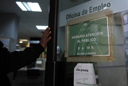 A man enters a government employment office in Sevilla. Spain's jobless rate surged to a record 24.4 percent at the end of March as 5.6 million people searched for work in a recession-bound, deficit-plagued economy, data showed Friday