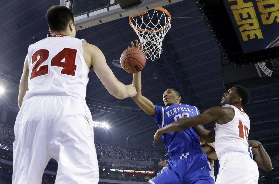 Wisconsin guard Bronson Koenig (24) and forward Nigel Hayes (10) defend against Kentucky forward Marcus Lee (00) during the first half of the NCAA Final Four tournament college basketball semifinal game Saturday, April 5, 2014, in Arlington, Texas. (AP Photo/Eric Gay)