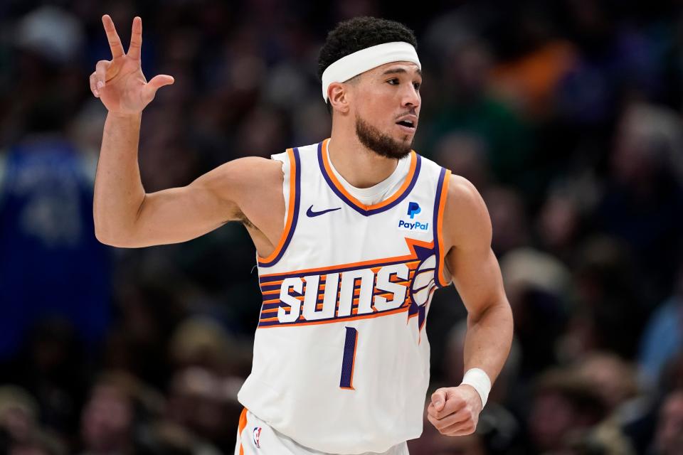 Devin Booker #1 of the Phoenix Suns celebrates after making a three-point basket during the second half against the Dallas Mavericks at American Airlines Center on Jan. 24, 2024 in Dallas, Texas.