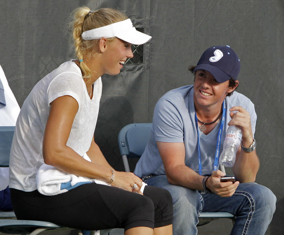 Second-ranked golfer Rory McIlroy and top-ranked tennis player Caroline Wozniacki met at a heavyweight boxing match in July, and they've been a hot item since. (AP Photo/Al Behrman)