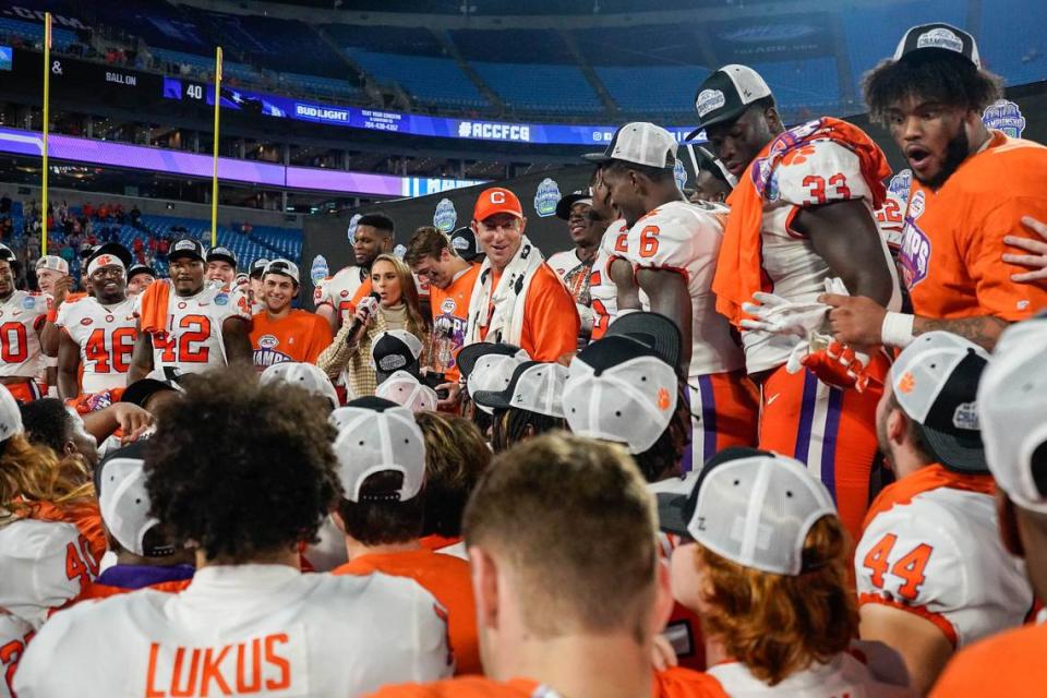Dec 3, 2022; Charlotte, North Carolina, USA; Clemson Tigers head coach Dabo Swinney is interviewed alongside his team on the stage during the victory celebration after the win over North Carolina Tar Heels at Bank of America Stadium. Mandatory Credit: Jim Dedmon-USA TODAY Sports Jim Dedmon/Jim Dedmon-USA TODAY Sports