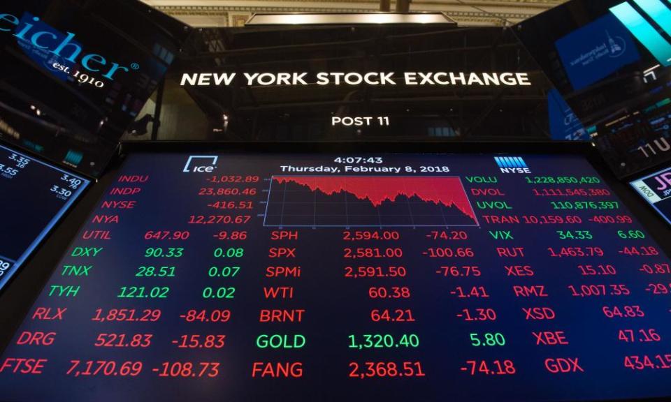 Figures at the New York stock exchange, as worries over interest rate hikes affected the markets.