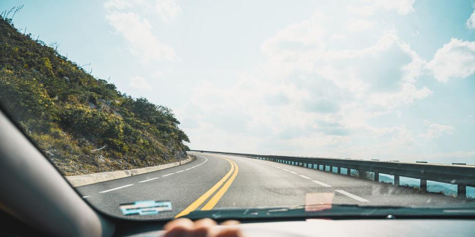 personal perspective of person driving on mountain road