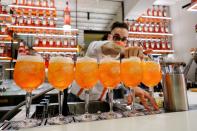 A bartender pours a drink at a Campari inauguration of a new brand house for Aperol, its best-selling beverage, in Venice, Italy