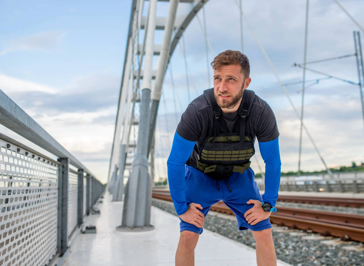 man getting tired during walk with weighted vest