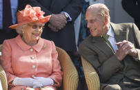 Prince Philip leans in to speak to the Queen as they enjoy the Royal Windsor Cup 2018 polo match at Guards Polo Club in June 2018. (Getty)