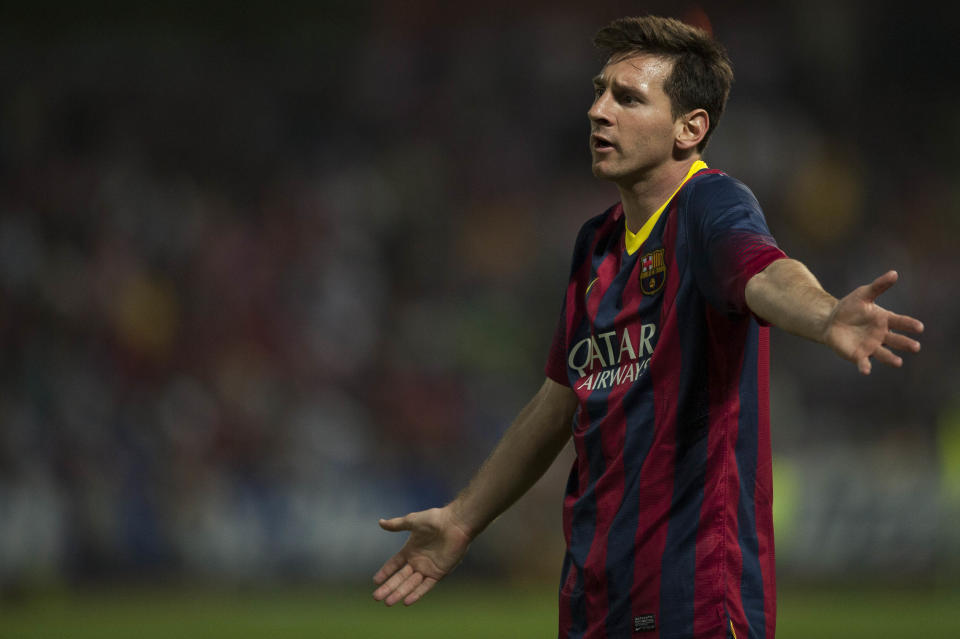 Barcelona's Lionel Messi from Argentina gestures during a Spanish La Liga soccer match between FC Granada and FC Barcelona at Los Carmenes stadium in Granada, Spain, Saturday, April 12, 2014. (AP Photo/Daniel Tejedor)