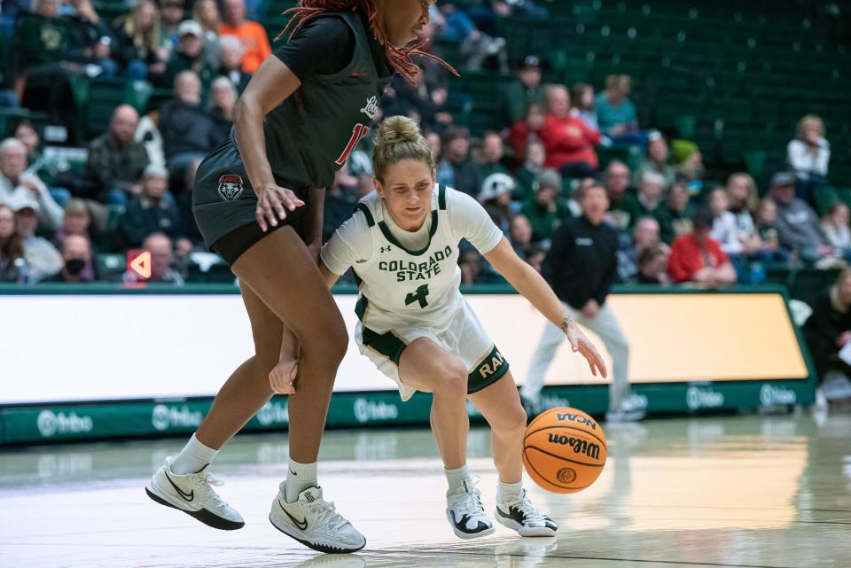 McKenna Hofschild (4) evades a Lobos defender during a Colorado State University women’s basketball game against New Mexico on Saturday, January 13, 2024, at Moby Arena in Fort Collins, Colo. Tanya B. Fabian/For The Coloradoan / USA TODAY NETWORK