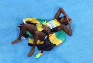 2016 Rio Olympics - Athletics - Final - Women's 200m Final - Olympic Stadium - Rio de Janeiro, Brazil - 17/08/2016. Elaine Thompson (JAM) of Jamaica reacts after winning the gold. REUTERS/Fabrizio Bensch