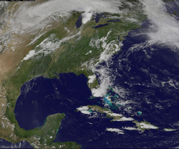 A line of thunderstorms that resembles an exclamation mark in this image from NOAA’s GOES-13 satellite gave rise to the Moore, Okla. tornado on May 20, 2013. The tornado was generated near the bottom of the line of clouds, NASA officials said.