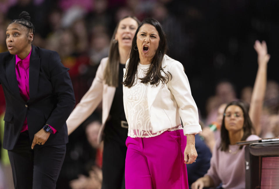 Nebraska head coach Amy Williams, right, yells at the referees, drawing a technical foul on her bench, while playing against Iowa during the second half of an NCAA college basketball game Sunday, Feb. 11, 2024, in Lincoln, Neb. (AP Photo/Rebecca S. Gratz)