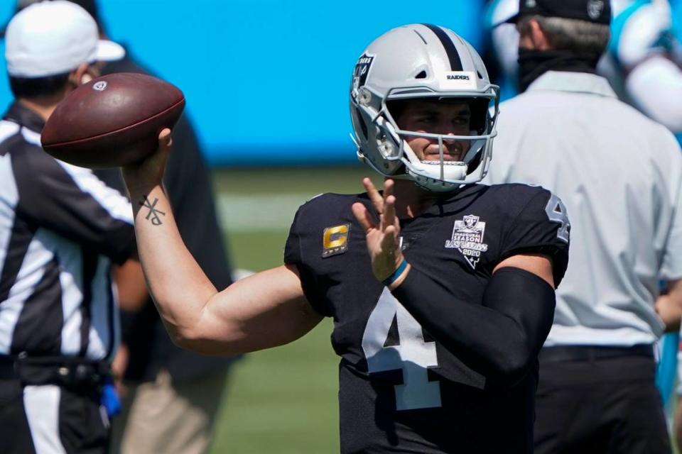 Las Vegas Raiders quarterback Derek Carr warms up before before an NFL football game against the Carolina Panthers Sunday, Sept. 13, 2020, in Charlotte, N.C. (AP Photo/Brian Blanco)