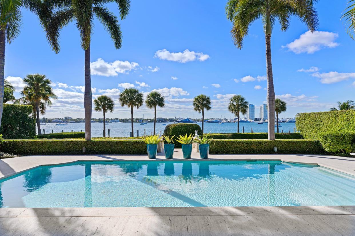 A house that just sold for a recorded $50 million in Palm Beach at 940 N. Lake Way offers wide views of the Intracoastal Waterway from the lakefront pool.