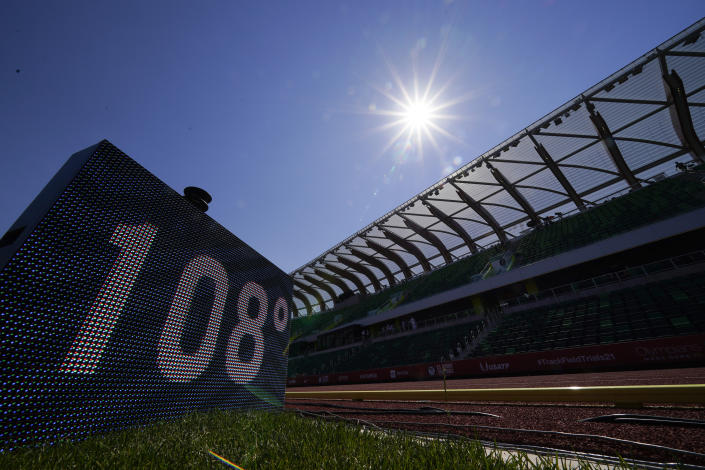 A sign displaying the current temperature is shown after events were postponed due to high heat at the U.S. Olympic Track and Field Trials Sunday, June 27, 2021, in Eugene, Ore. (AP Photo/Charlie Riedel)