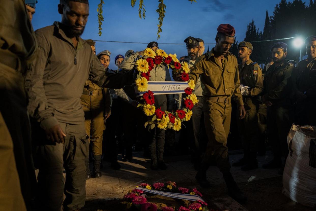 Israeli soldiers attend the funeral of Staff Sgt. Emanuel Feleke, an Ethiopian Israeli who was killed in Gaza in December 2023. <a href="https://mapi.associatedpress.com/v2/items/5320f5473bf34946bebeeaba8ea7f0ec/preview/AP23341614355104.jpg?wm=api&tag=app_id=1,user_id=904438,org_id=101781" rel="nofollow noopener" target="_blank" data-ylk="slk:Ohad Zwigenberg;elm:context_link;itc:0;sec:content-canvas" class="link ">Ohad Zwigenberg</a>