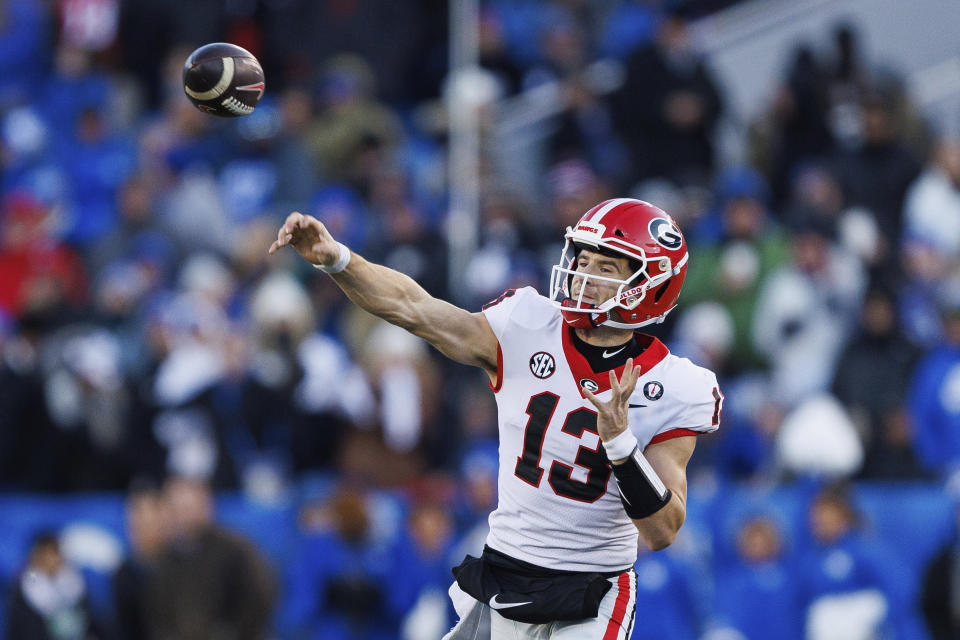 Georgia quarterback Stetson Bennett throws a pass during the first half of an NCAA college football game against Kentucky in Lexington, Ky., Saturday, Nov. 19, 2022. (AP Photo/Michael Clubb)