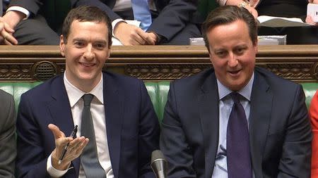 A still image from video shows Britain's Chancellor of the Exchequer George Osborne ( L) seated next to Britain's Prime Minister David Cameron after delivering the Autumn Statement to Parliament in London, Britain November 25, 2015. REUTERS/UK Parliament via REUTERS TV