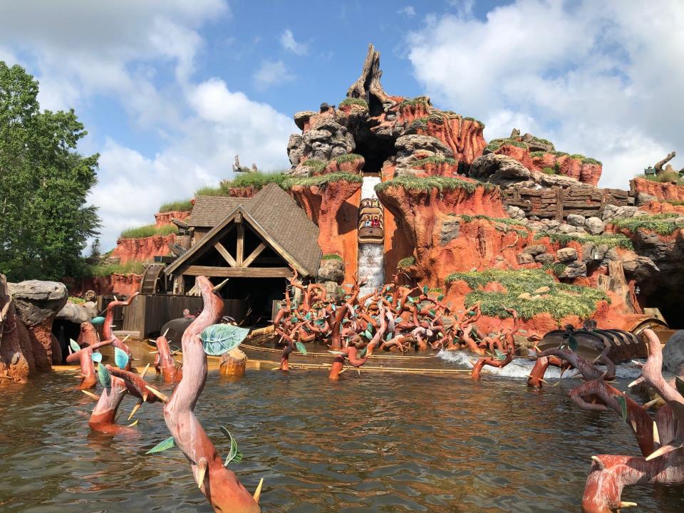 Guests scream through their masks on Splash Mountain.