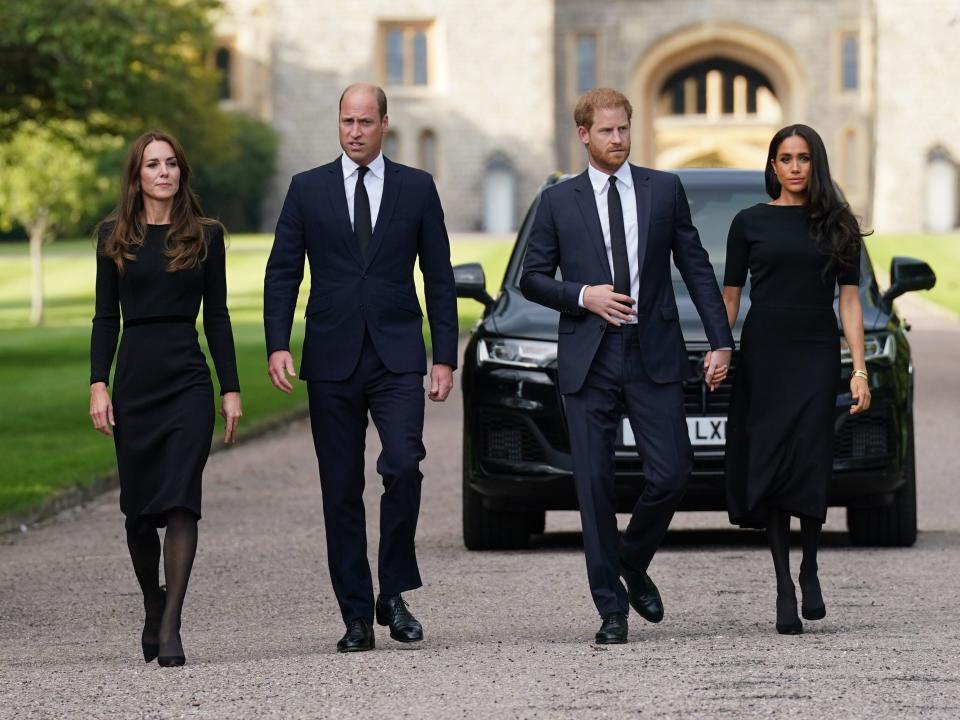 Prince William, Princess Kate, Prince Harry, and Meghan Markle on a walk at Windsor Castle