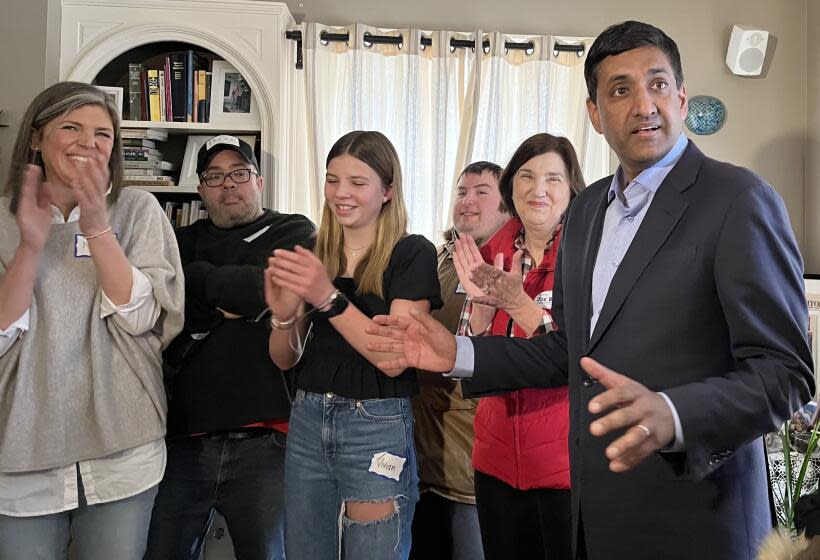 Rep. Ro Khanna (D-Fremont) speaks to a gathering of Biden supporters and press at a Concord home Saturday. Although Biden will not be on the Democratic primary ticket in New Hampshire Tuesday, surrogates like Khanna are swarming the state to get out the vote for the president anyway.