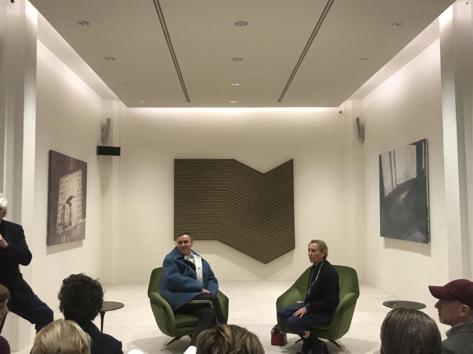 Miuccia Prada and Raf Simons, left, hold a press conference in Milan, Italy, Sunday, Feb. 23, 2020, on the sidelines of Milan Fashion Week. They announced their collaboration on Prada collections from Spring/Summer 2021, going forward indefinitely, the designers announced Sunday. (AP Photo/Colleen Barry)