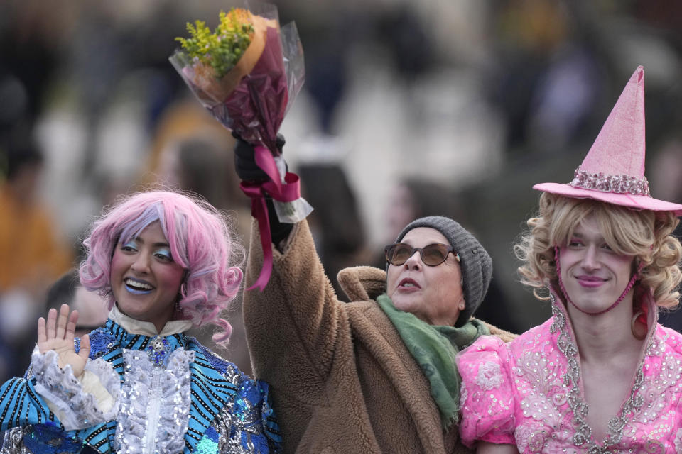 Actor Annette Bening, center, Hasty Pudding 2024 Woman of the Year, rides in a convertible with Harvard University theatrical students Nikita Nair, left, and Joshua Hillers, right, during a parade, Tuesday, Feb. 6, 2024, through Harvard Yard, in Cambridge, Mass. The award was presented to Bening by Hasty Pudding Theatricals, a theatrical student society at Harvard University. (AP Photo/Steven Senne)