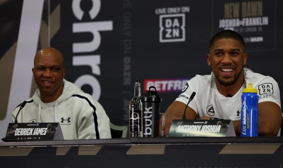 Joshua (right) with his new coach Derrick James (Getty Images)