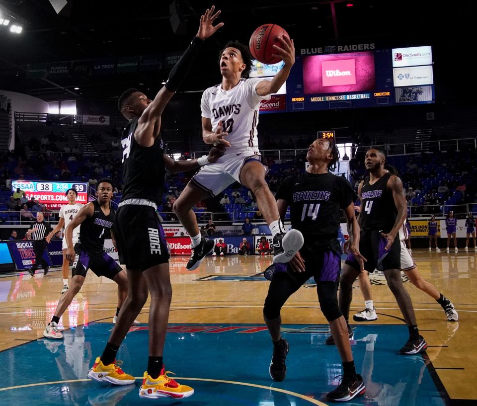 Bearden guard Elijah Bredwood (00) shoots past Cane Ridge forward Brandon Miller (24) and guard Joshua McDaniel (14) during the second half of their game in the TSSAA 2022 Class 4A State Boys' Basketball Tournament at Murphy Center Wednesday, March 16, 2022 in Murfreesboro, Tenn.