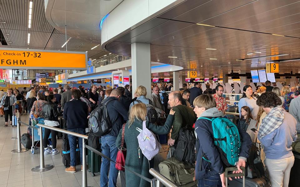 Travellers left stranded at Schiphol airport after unannounced strikes in April last year - REUTERS/Anthony Deutsch