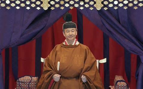  Japan's Emperor Naruhito stands in the Imperial Throne "Takamikura" - Credit: &nbsp;Pool/&nbsp;Pool