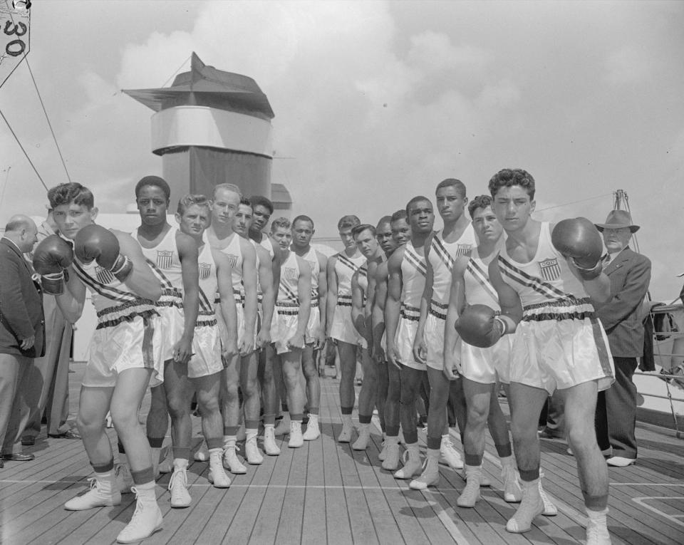 Members of the U.S. Olympic boxing team pose on a deck of the Liner America while en route to England for the Olympic games on July 22, 1948. Virginia's Norvel Lee is just left of center, eighth from left.