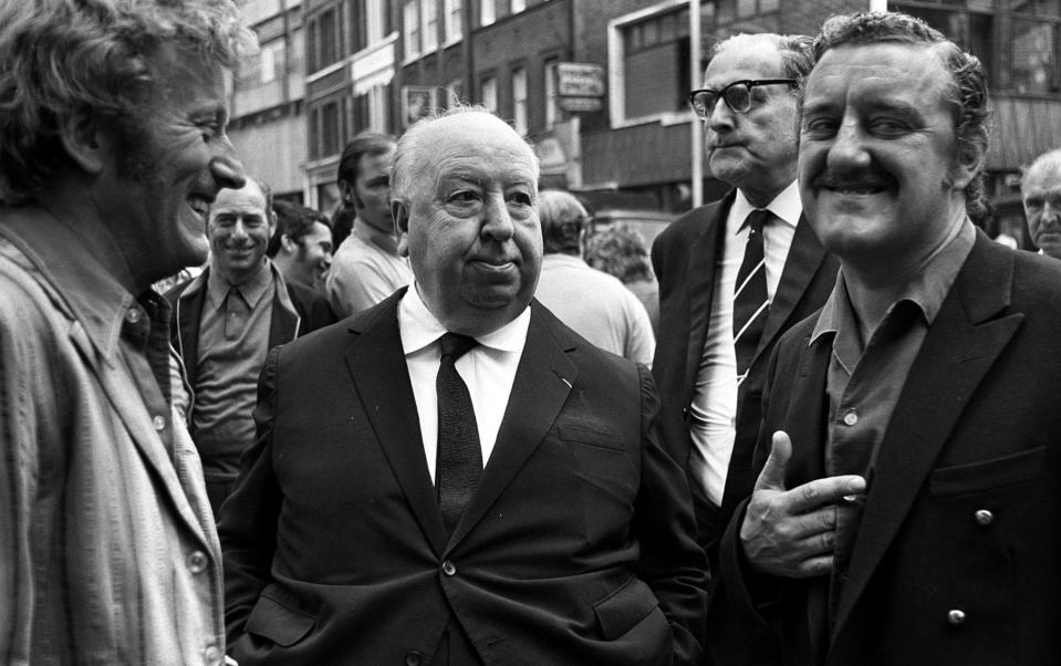 Cribbins (right) with Alfred Hitchcock (centre) on the set of Frenzy - Popperfoto