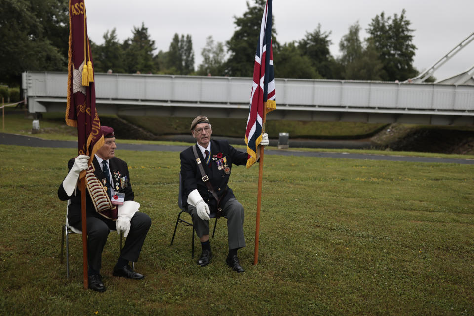 British Veterans attend the ceremony at Pegasus Bridge, in Ranville, Normandy, Sunday, June, 5, 2022. On Monday, the Normandy American Cemetery and Memorial, home to the gravesites of 9,386 who died fighting on D-Day and in the operations that followed, will host U.S. veterans and thousands of visitors in its first major public ceremony since 2019. (AP Photo/Jeremias Gonzalez)