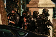 <p>St. Louis Police Department officers stand on the street in riot gear after a not guilty verdict in the murder trial of Jason Stockley, a former St. Louis police officer, charged with the 2011 shooting of Anthony Lamar Smith, who was black, in St. Louis, Mo., Sept. 15, 2017. (Photo: Lawrence Bryant/Reuters) </p>