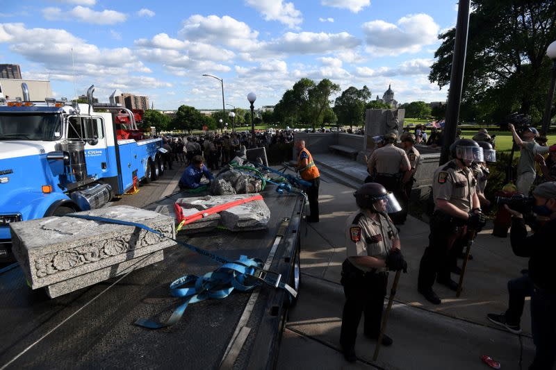 Demonstrators pulled down the statue of Christopher Columbus from the Minnesota State Capitol grounds