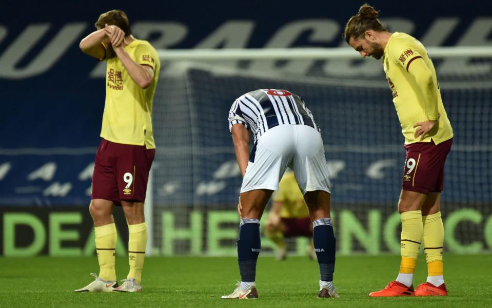 West Brom and Burnley players look exhausted at the final whistle - GETTY IMAGES