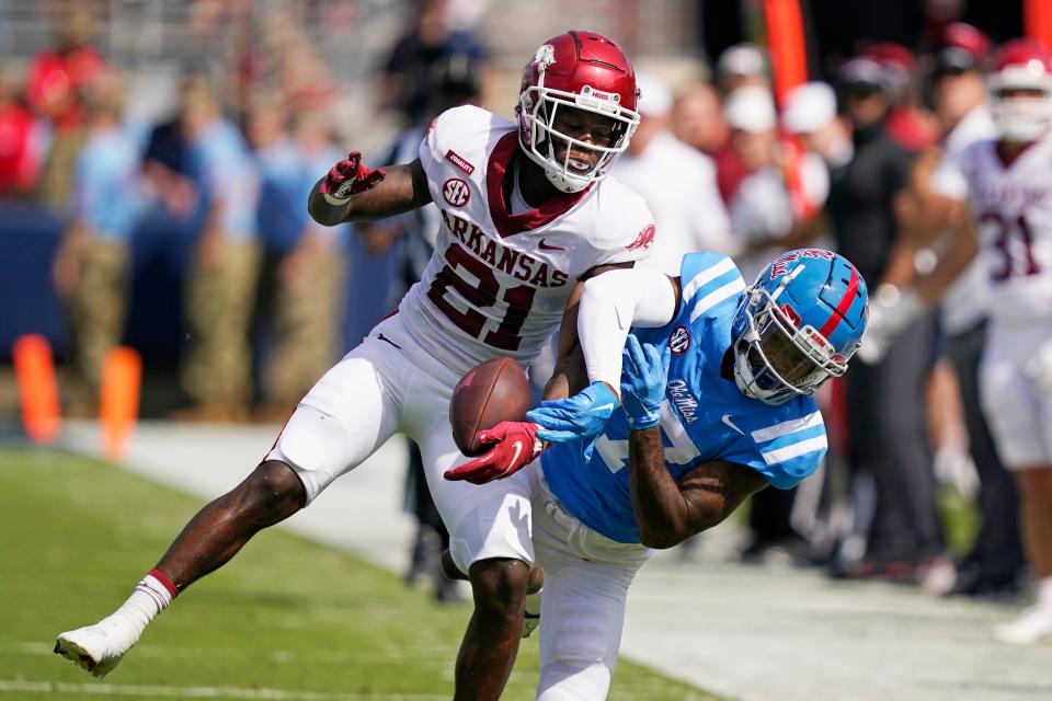 Buster Brown (21) started his last 31 college games at Arkansas and helped the Razorbacks reverse course and finish 9-4 last season.