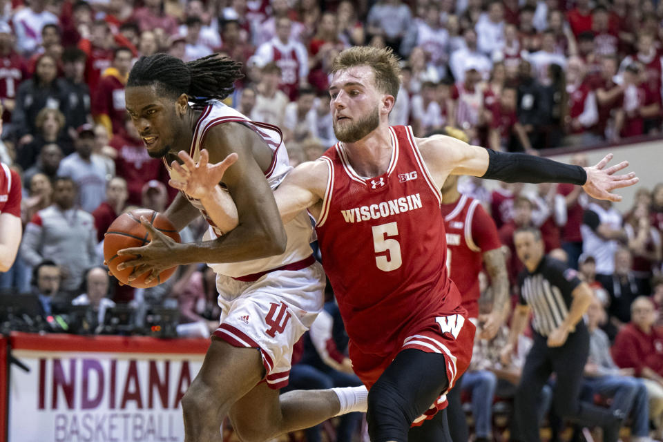 Wisconsin forward Tyler Wahl (5) makes an attempt to stop a break-away run by Indiana forward Mackenzie Mgbako during the second half of an NCAA college basketball game, Tuesday, Feb. 27, 2024, in Bloomington, Ind. (AP Photo/Doug McSchooler)