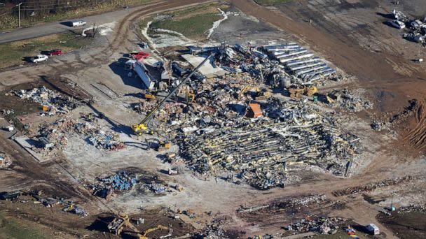 PHOTO: In this aerial view, crews clear the rubble at the Mayfield Consumer Products candle factory after it was destroyed by a tornado three days prior, on Dec. 13, 2021 in Mayfield, Ky. (Scott Olson/Getty Images)